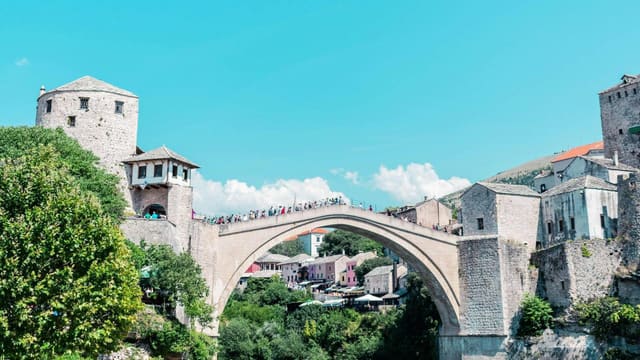 The Stari Most stone bridge over the green Neretva in Mostar